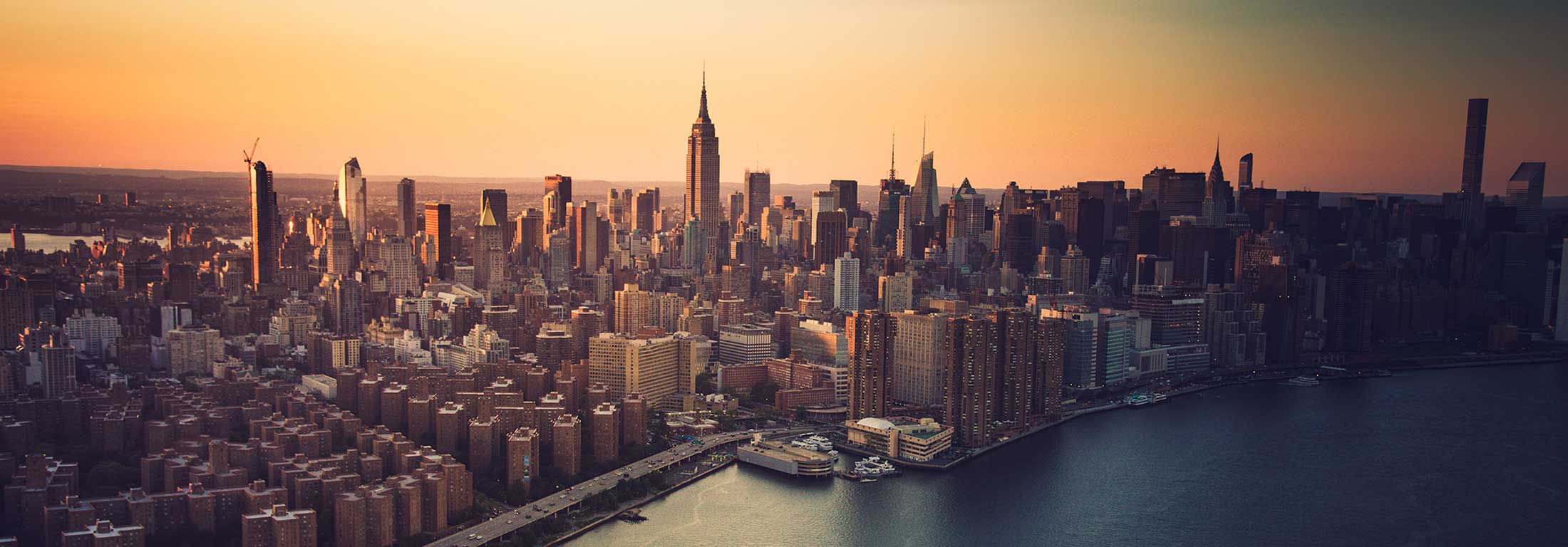 Aerial view of Manhattan with crisp orange sunrise